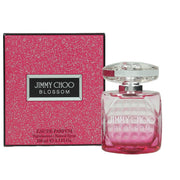 Blossom Eau De Parfum Jimmy Choo 100 ml i fuchsia-rosa glasflaske med facetslebet, diamantformet låg og elegant design