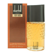 Dunhill for Men Eau de Toilette 100 ml fra Dunhill, klar rektangulær glasflaske med gylden duft og sølvfarvet låg.