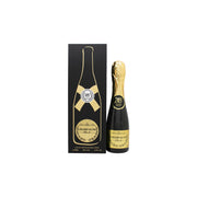 Bharara Champagne Black Eau de Parfum 100 ml fra Bharara Beauty – sort, cylindrisk flakon med gyldent låg og enkelt design