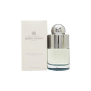 Molton Brown Coastal Cypress & Sea Fennel Eau de Toilette 100 ml, klar glasflaske med sølvfarvet låg og havblå væske