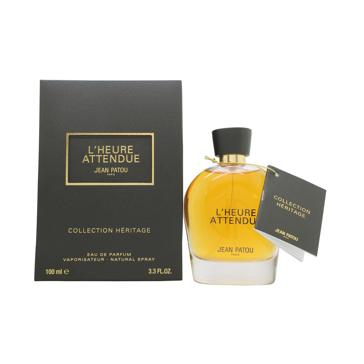 Jean Patou Heritage L'Heure Attendue Eau de Parfum 100 ml – klar, rund glasflakon med gylden essens og sort kubisk låg.