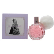 Ariana Grande Ari Eau de Parfum fra Ariana Grande 100 ml – rund lyserød glasflakon med facetslebet mønster og hvid pompon.
