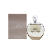 Jennifer Lopez Still Eau de Parfum 100 ml i slank frostet glasflaske med blød kurve, gylden væske og sølvring.